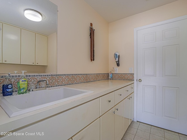 bathroom featuring tile patterned flooring and vanity