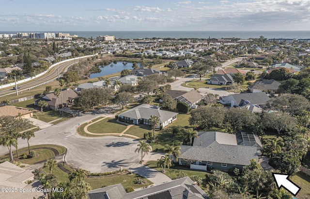 drone / aerial view with a water view