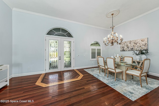 dining room with french doors, baseboards, dark wood-type flooring, and crown molding