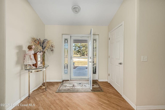 entryway with wood-type flooring