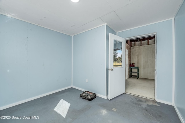 unfurnished room featuring concrete flooring