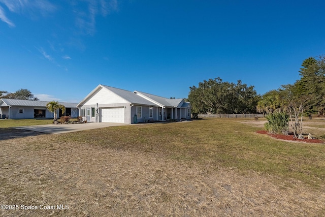 view of front facade featuring a front yard and a garage