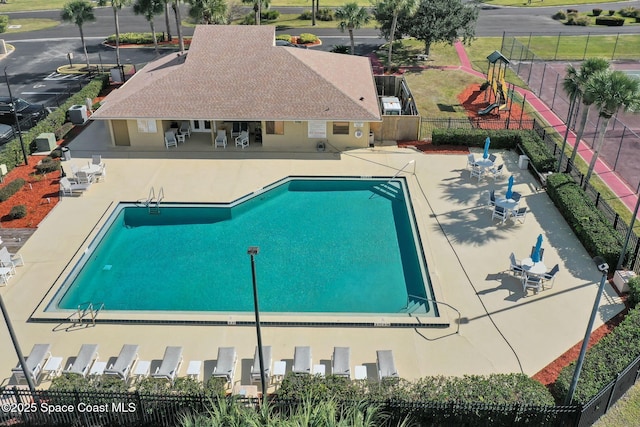 view of swimming pool with a patio area