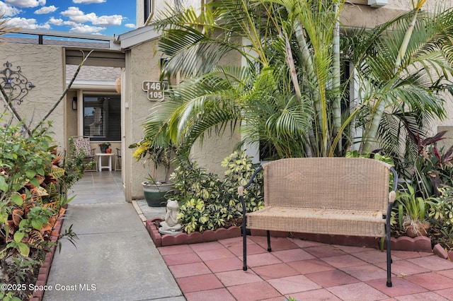 doorway to property with a patio area