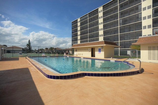 view of swimming pool featuring a patio area