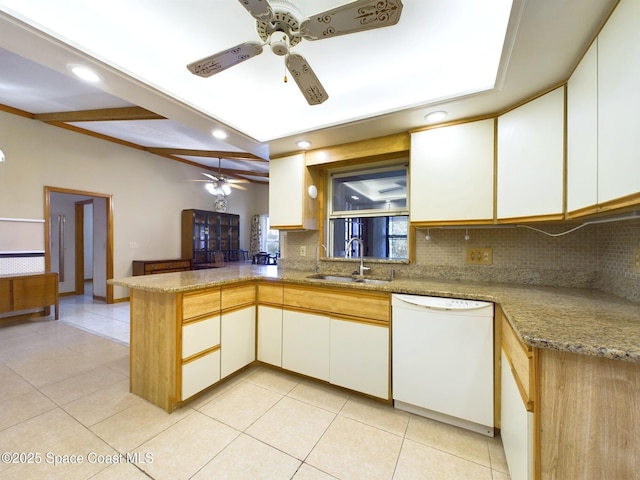 kitchen featuring light stone countertops, kitchen peninsula, sink, and dishwasher