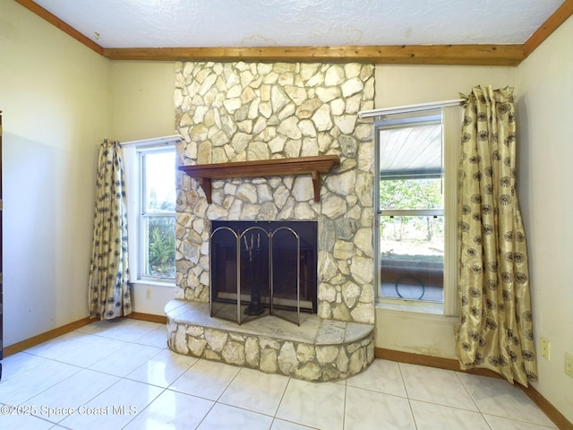 unfurnished living room featuring tile patterned flooring, a stone fireplace, and a textured ceiling