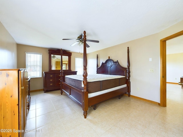 bedroom with ceiling fan and light tile patterned floors