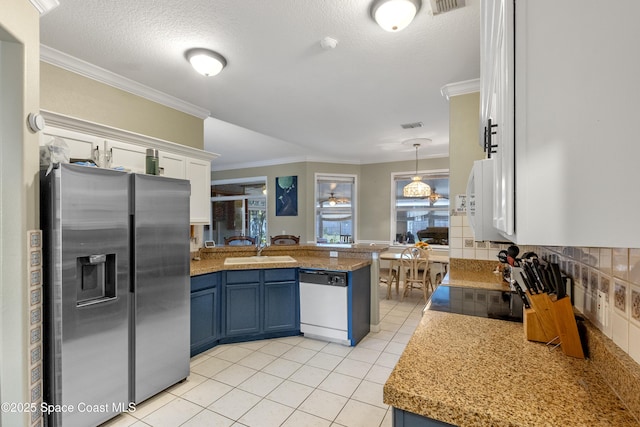 kitchen featuring dishwasher, stainless steel refrigerator with ice dispenser, white cabinetry, blue cabinetry, and kitchen peninsula