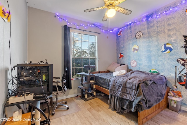 bedroom with ceiling fan and light wood-type flooring