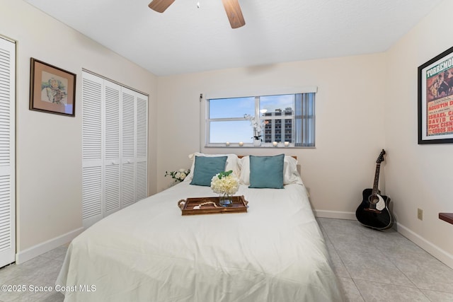 tiled bedroom with ceiling fan