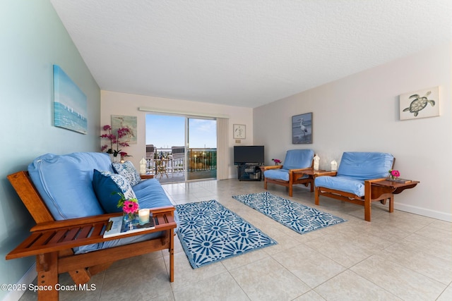 tiled living room with a textured ceiling