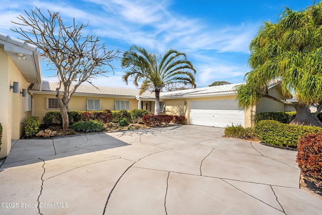 ranch-style home with a garage