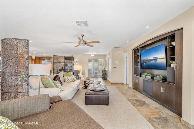 living room featuring ceiling fan