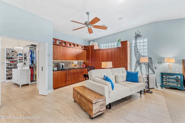 living room with sink and ceiling fan