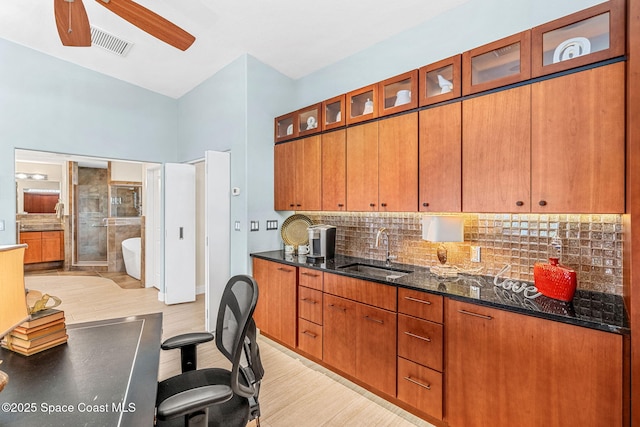 office space with sink, light hardwood / wood-style floors, and ceiling fan