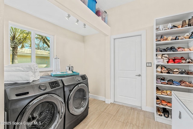 washroom featuring independent washer and dryer