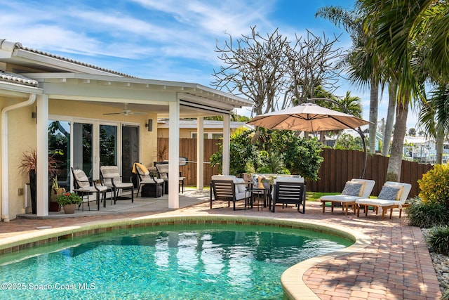 view of swimming pool with an outdoor hangout area, a patio, and ceiling fan