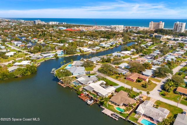 drone / aerial view with a water view