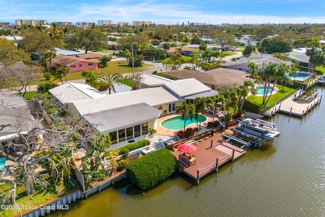 birds eye view of property with a water view