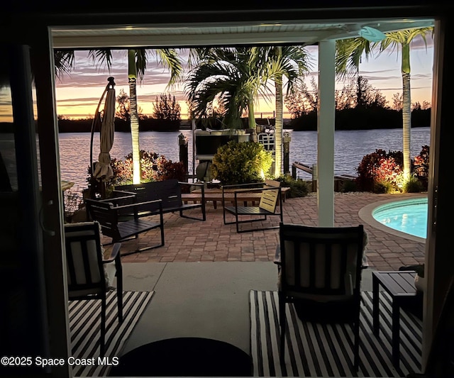 patio terrace at dusk with a water view