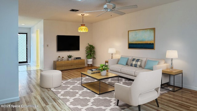 living room with ceiling fan and light wood-type flooring