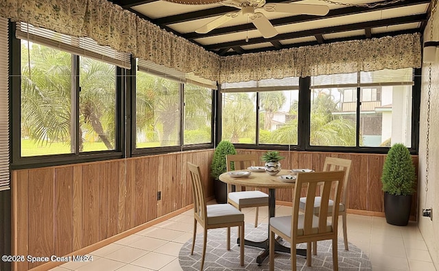 sunroom featuring ceiling fan and a healthy amount of sunlight