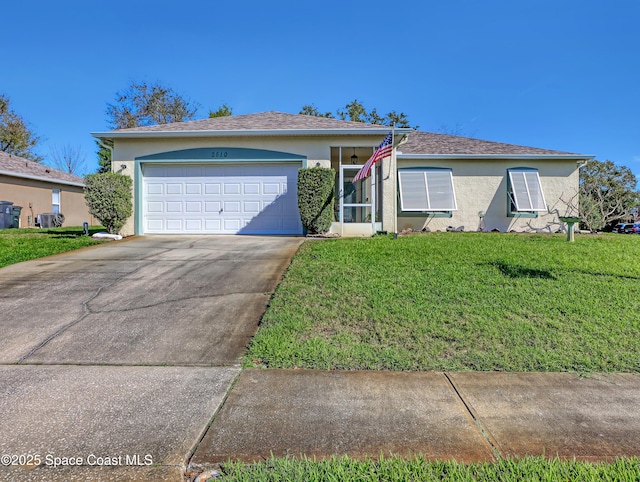 view of front of home with a garage and a front yard