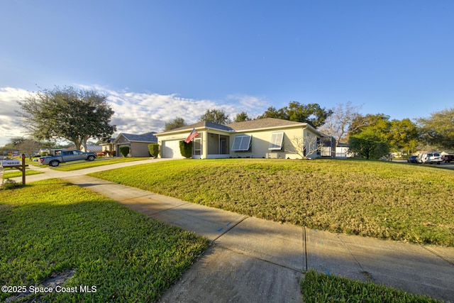 view of side of home with a garage and a lawn