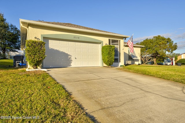 view of front of house featuring a garage and a front lawn