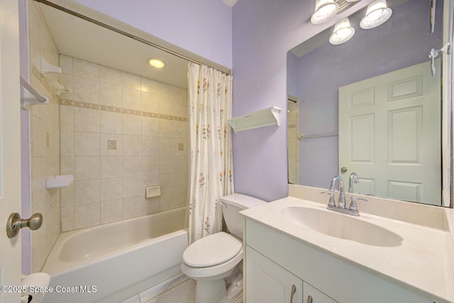 bathroom with shower / tub combo with curtain, vanity, toilet, and tile patterned floors