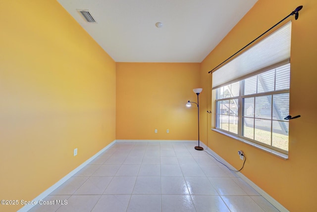 unfurnished room featuring light tile patterned flooring