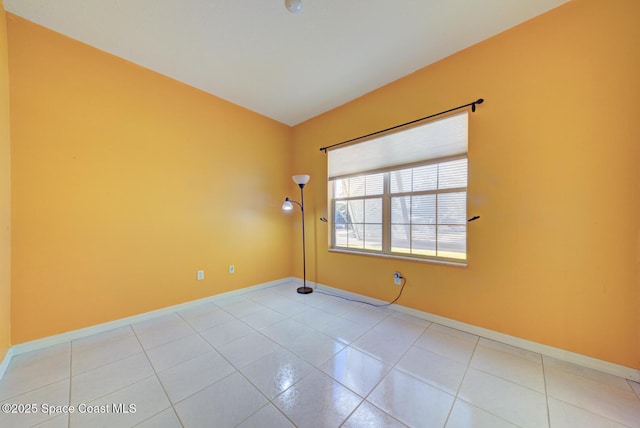 spare room featuring light tile patterned floors