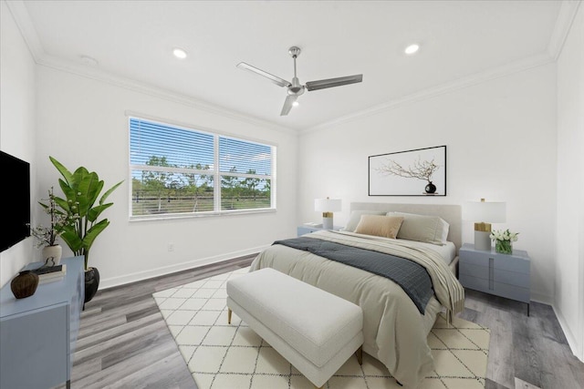 bedroom with ceiling fan, light hardwood / wood-style flooring, and ornamental molding