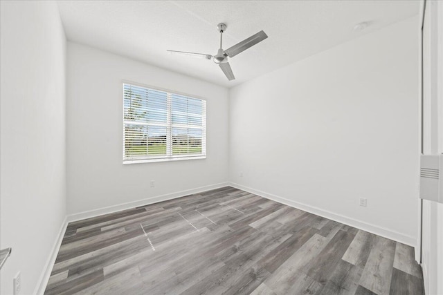 empty room with wood-type flooring and ceiling fan