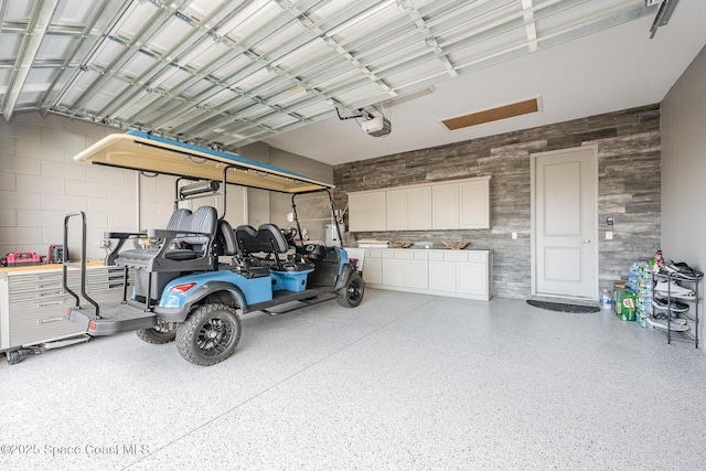 garage featuring a garage door opener