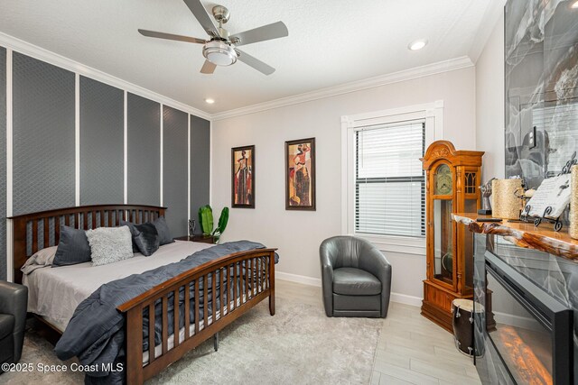 bedroom featuring ceiling fan, ornamental molding, and light hardwood / wood-style floors