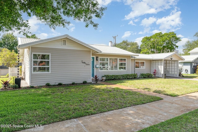 ranch-style home with a front yard