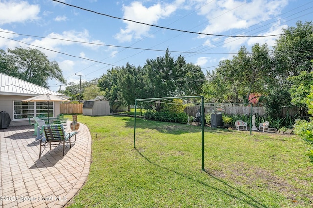 view of yard with a patio area and a shed