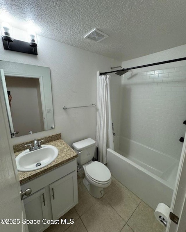 full bathroom featuring toilet, tile patterned flooring, shower / bathtub combination with curtain, and vanity