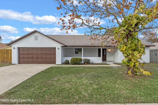 ranch-style house featuring a garage and a front yard