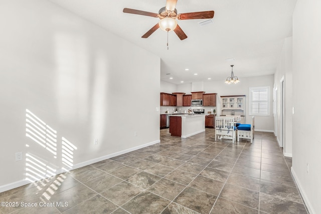 living room with ceiling fan with notable chandelier