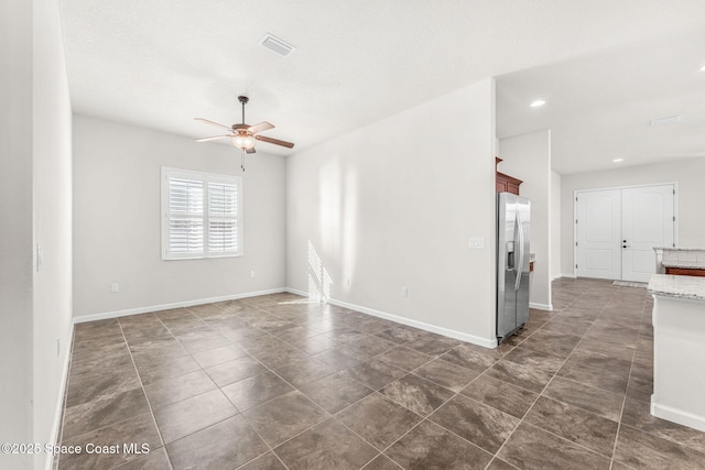 spare room with ceiling fan