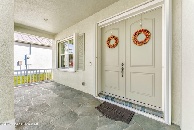 doorway to property featuring a porch