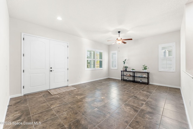 foyer with ceiling fan