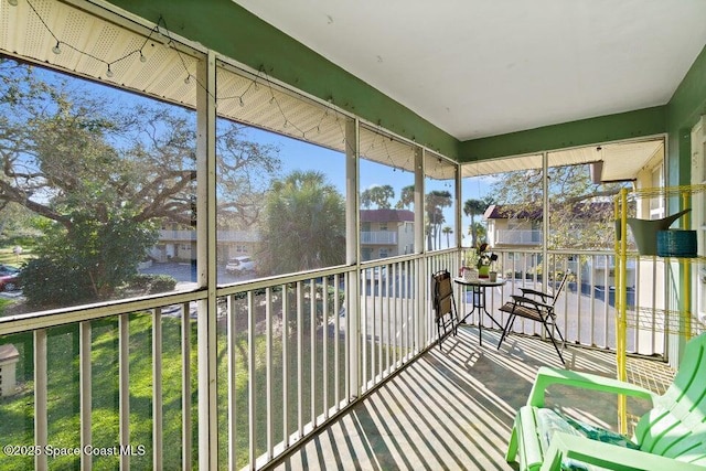 unfurnished sunroom with plenty of natural light