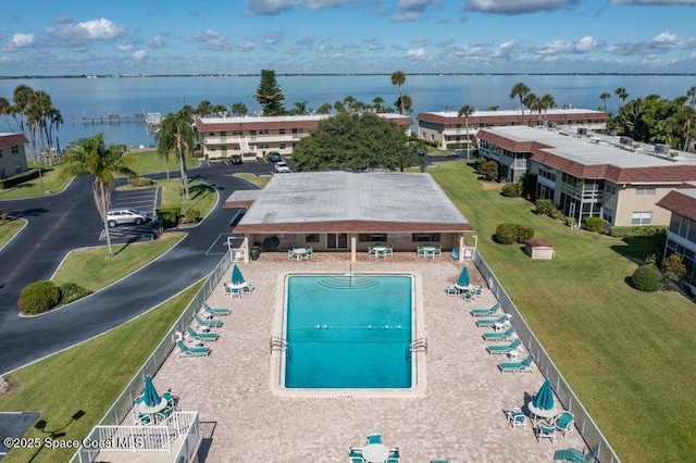 view of swimming pool with a water view