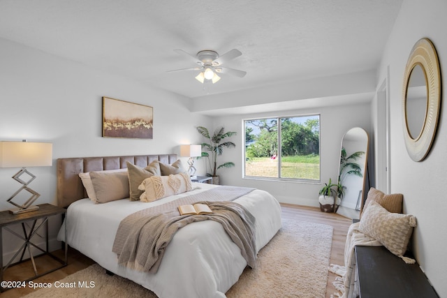 bedroom featuring ceiling fan and wood-type flooring