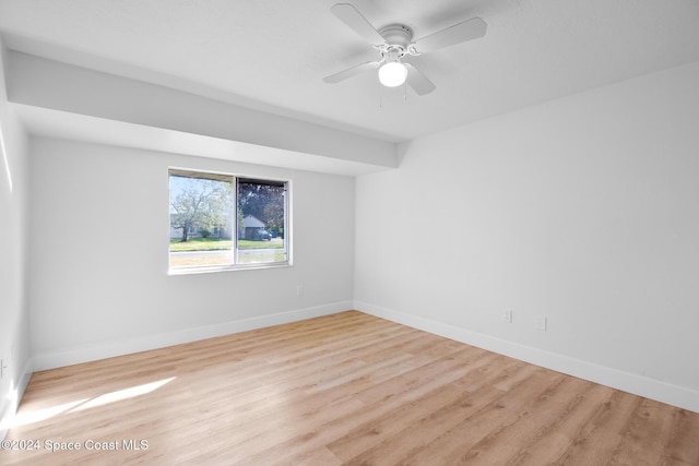 spare room with ceiling fan and light hardwood / wood-style floors