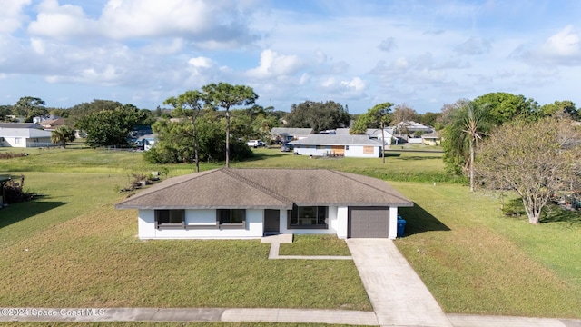 ranch-style house with a front yard and a garage